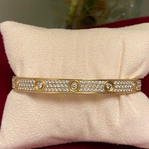 Size 21, measures 8” Cartier style 18k solid gold bracelet.